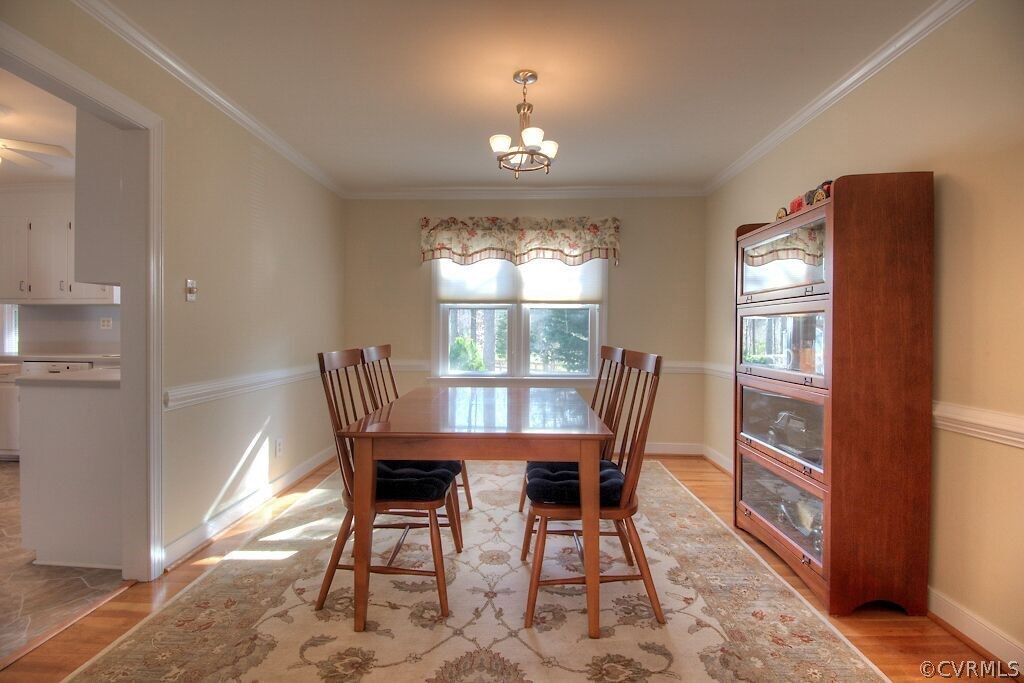 13325 Lady Ashley Road Midlothian, VA 23114 - Photo 8 of 31 a view of a dining room with furniture window and wooden floor
