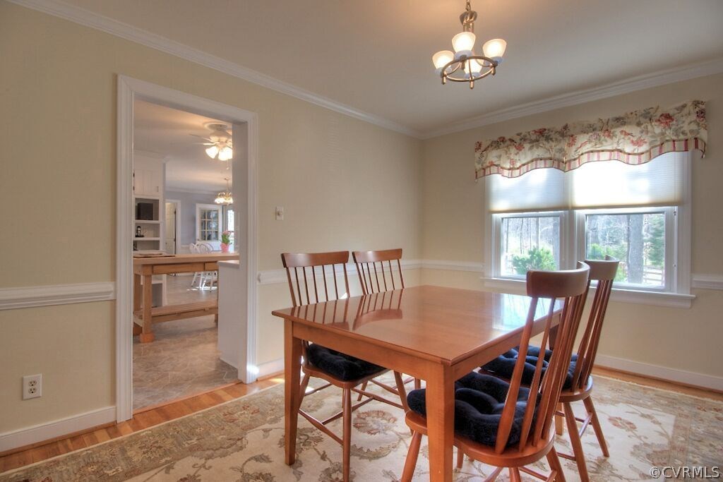 13325 Lady Ashley Road Midlothian, VA 23114 - Photo 9 of 31 a view of a dining room with furniture window and wooden floor