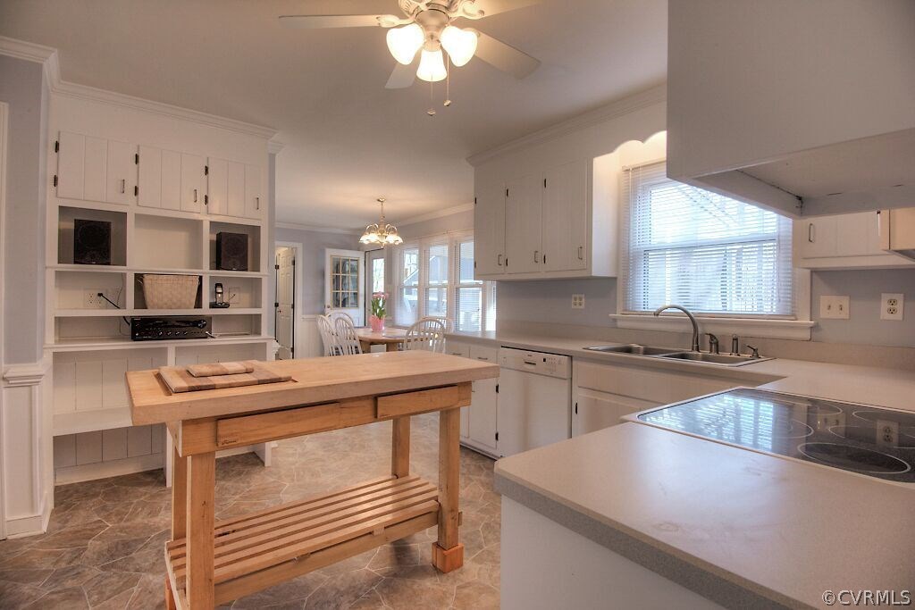 13325 Lady Ashley Road Midlothian, VA 23114 - Photo 10 of 31 a kitchen with kitchen island granite countertop a sink cabinets and stainless steel appliances