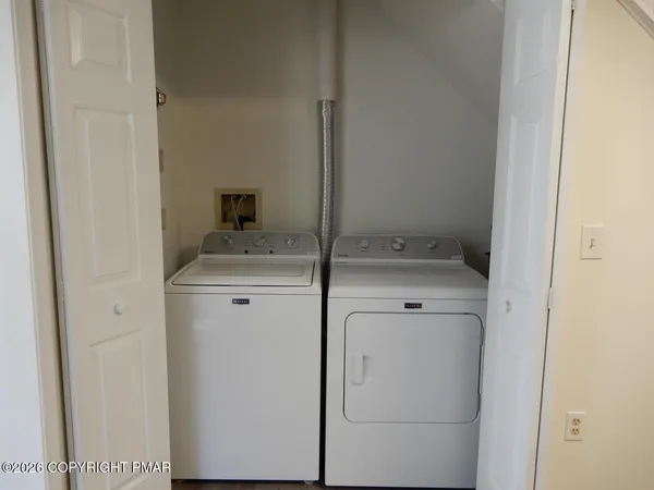 a bathroom with a sink toilet and mirror