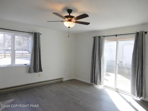 a view of an empty room with a window