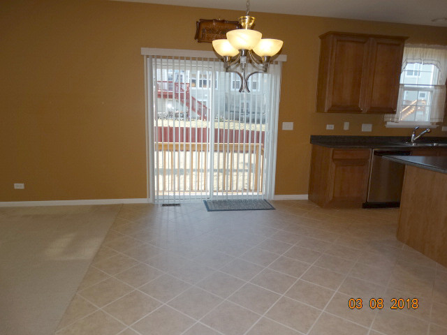 314 Monument Road Elgin, IL 60124 - Photo 11 of 16 a view of an empty room with a window