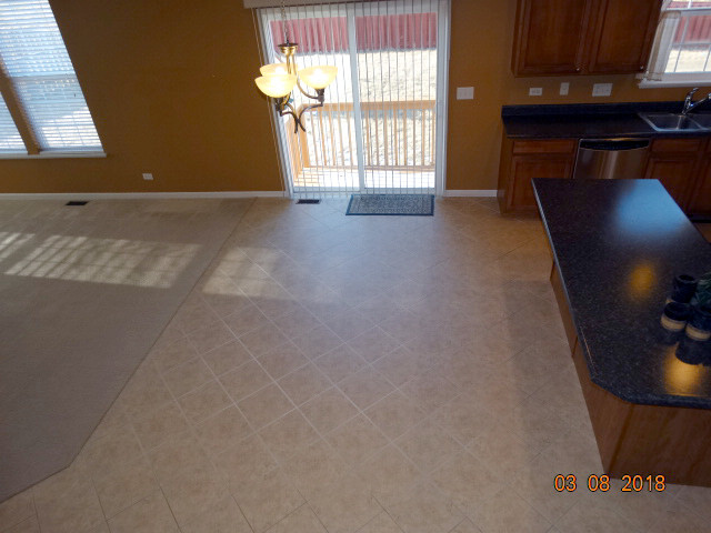 314 Monument Road Elgin, IL 60124 - Photo 12 of 16 an empty room with windows
