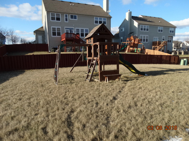 314 Monument Road Elgin, IL 60124 - Photo 13 of 16 a view of a house with backyard