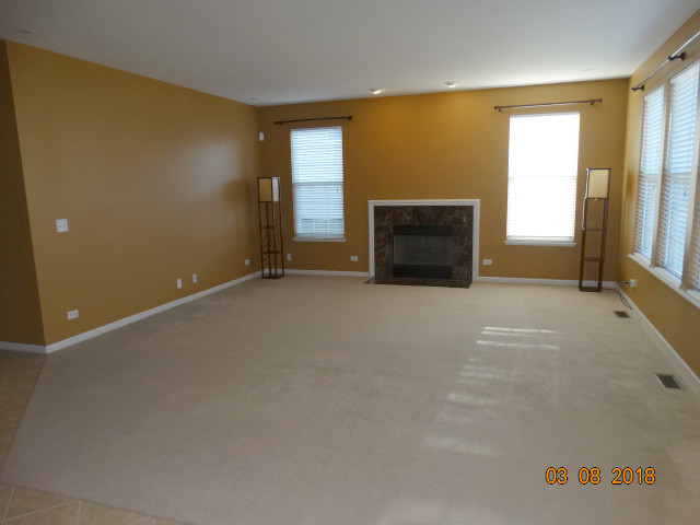 314 Monument Road Elgin, IL 60124 - Photo 14 of 16 an empty room with windows
