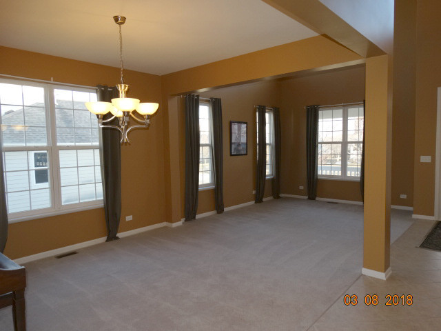 314 Monument Road Elgin, IL 60124 - Photo 5 of 16 a view of a room with large windows