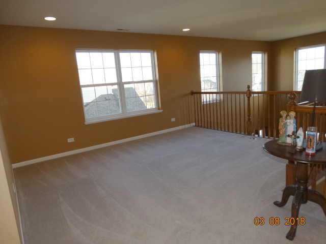 314 Monument Road Elgin, IL 60124 - Photo 6 of 16 a view of an empty room with a window