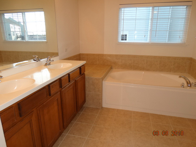 314 Monument Road Elgin, IL 60124 - Photo 7 of 16 a bathroom with a sink and a bathtub