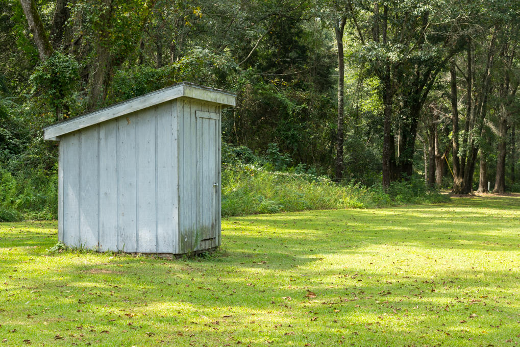 423 Tedder Road East DeFuniak Springs, FL 32433 - Photo 27 of 29 a view of a backyard with large trees