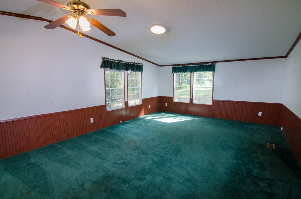 423 Tedder Road East DeFuniak Springs, FL 32433 - Photo 8 of 29 a view of an empty room with window and stairs