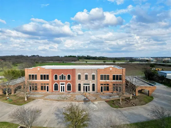 a view of a big yard with big house