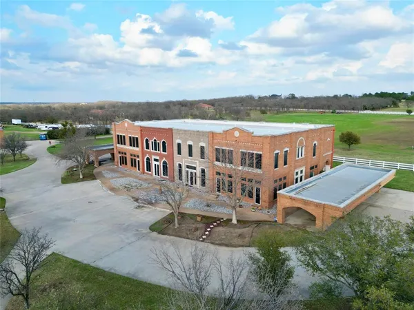 an aerial view of a house with a garden