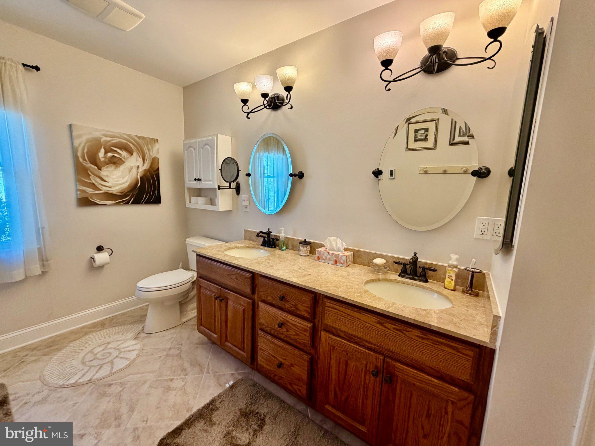 211 William Cook Boulevard Manahawkin, NJ 08050 - Photo 46 of 71 Elegant bathroom with dual sinks.