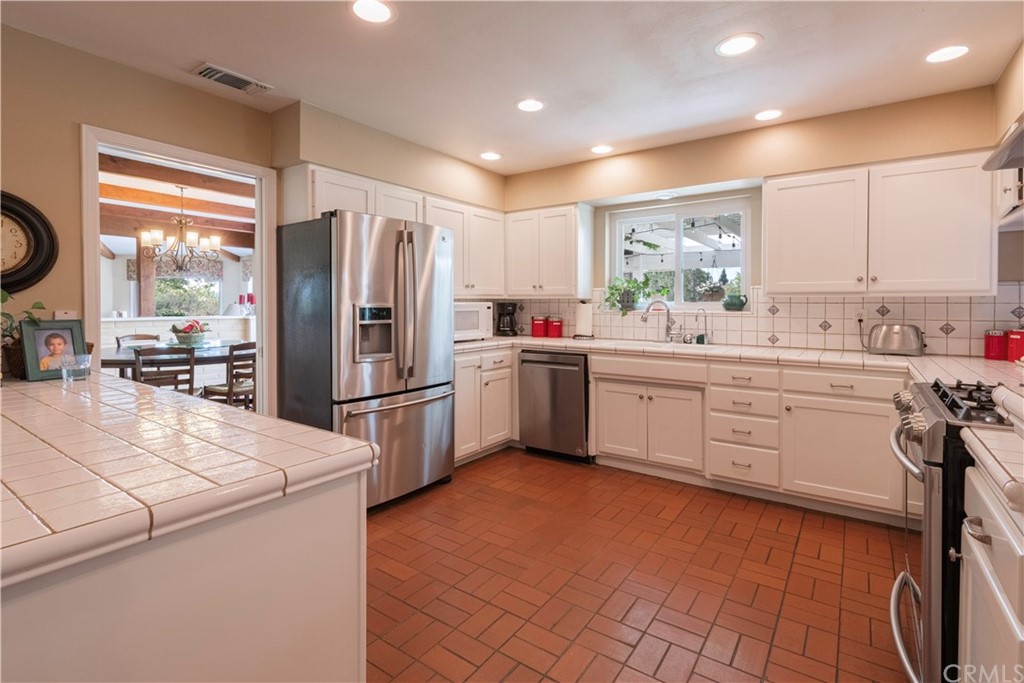 2755 Ardilla Road Atascadero, CA 93422 - Photo 11 of 42 a kitchen with a sink appliances and cabinets