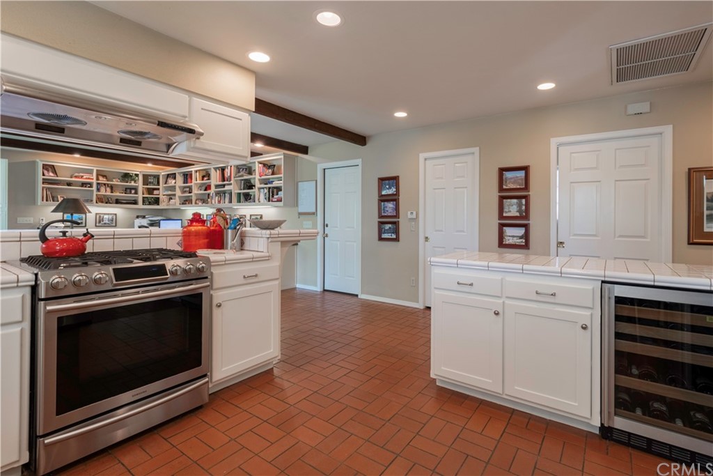 2755 Ardilla Road Atascadero, CA 93422 - Photo 12 of 42 a kitchen with stainless steel appliances granite countertop a stove and a sink