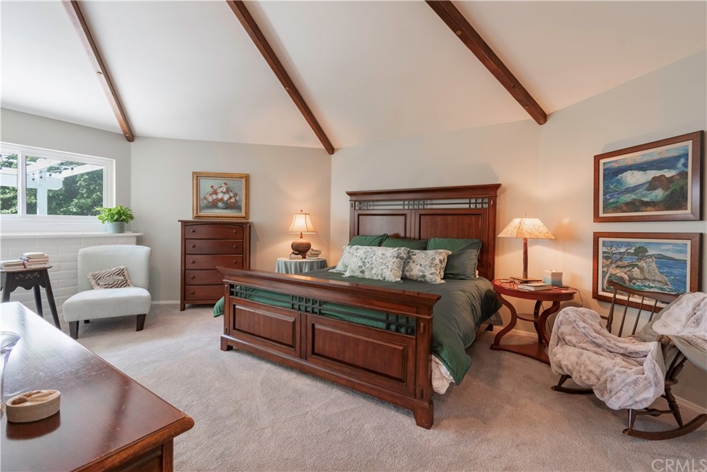 2755 Ardilla Road Atascadero, CA 93422 - Photo 19 of 42 a bed room with furniture and a fireplace