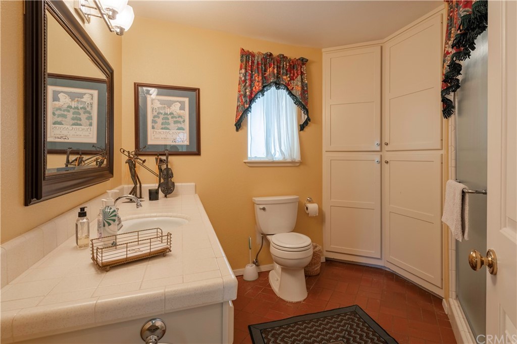 2755 Ardilla Road Atascadero, CA 93422 - Photo 24 of 42 a bathroom with a sink toilet and vanity