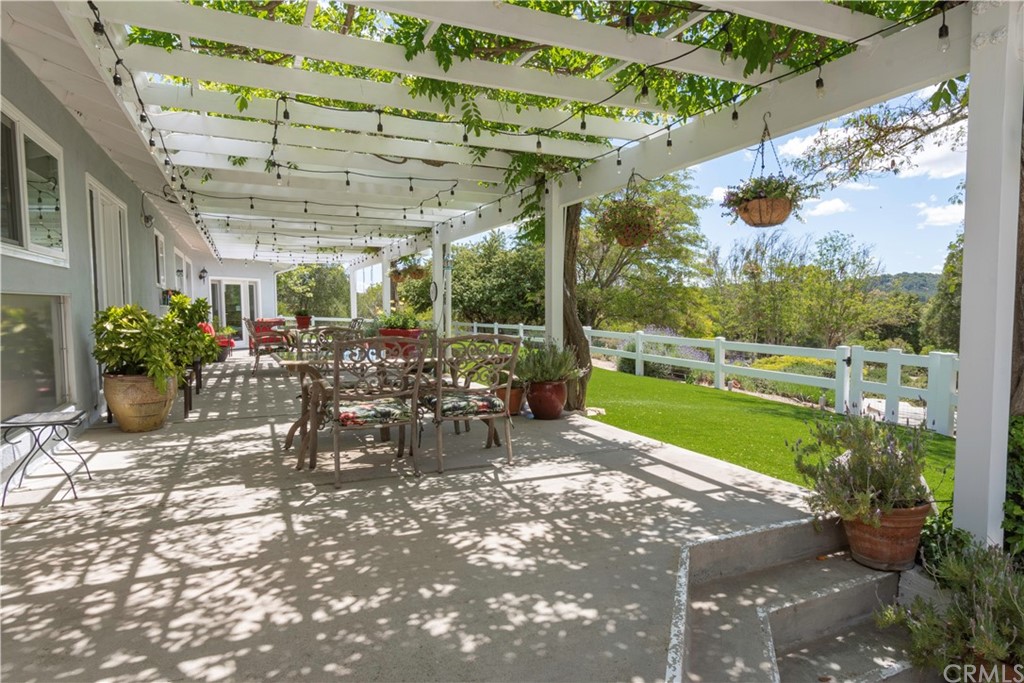 2755 Ardilla Road Atascadero, CA 93422 - Photo 26 of 42 a view of a porch with chairs and a yard