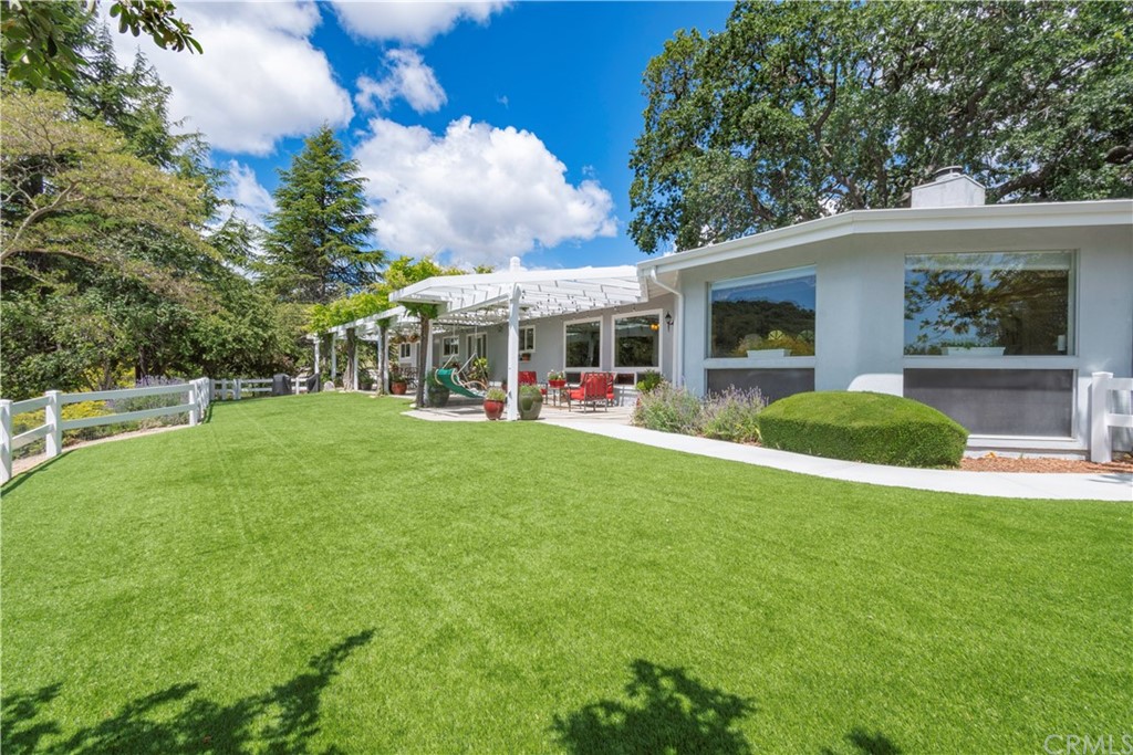 2755 Ardilla Road Atascadero, CA 93422 - Photo 30 of 42 a view of a house with a backyard porch and sitting area