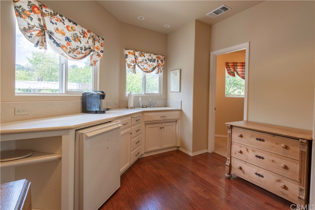 2755 Ardilla Road Atascadero, CA 93422 - Photo 35 of 42 a kitchen with cabinets a window and appliances