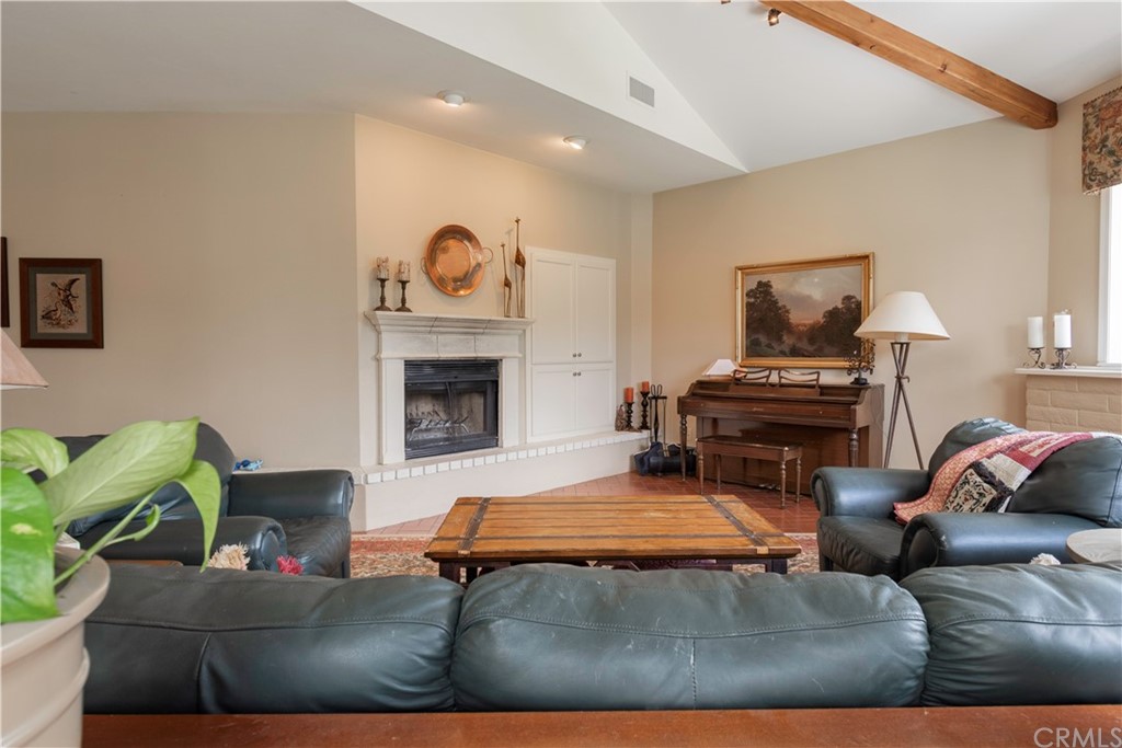 2755 Ardilla Road Atascadero, CA 93422 - Photo 6 of 42 a living room with furniture and a fireplace
