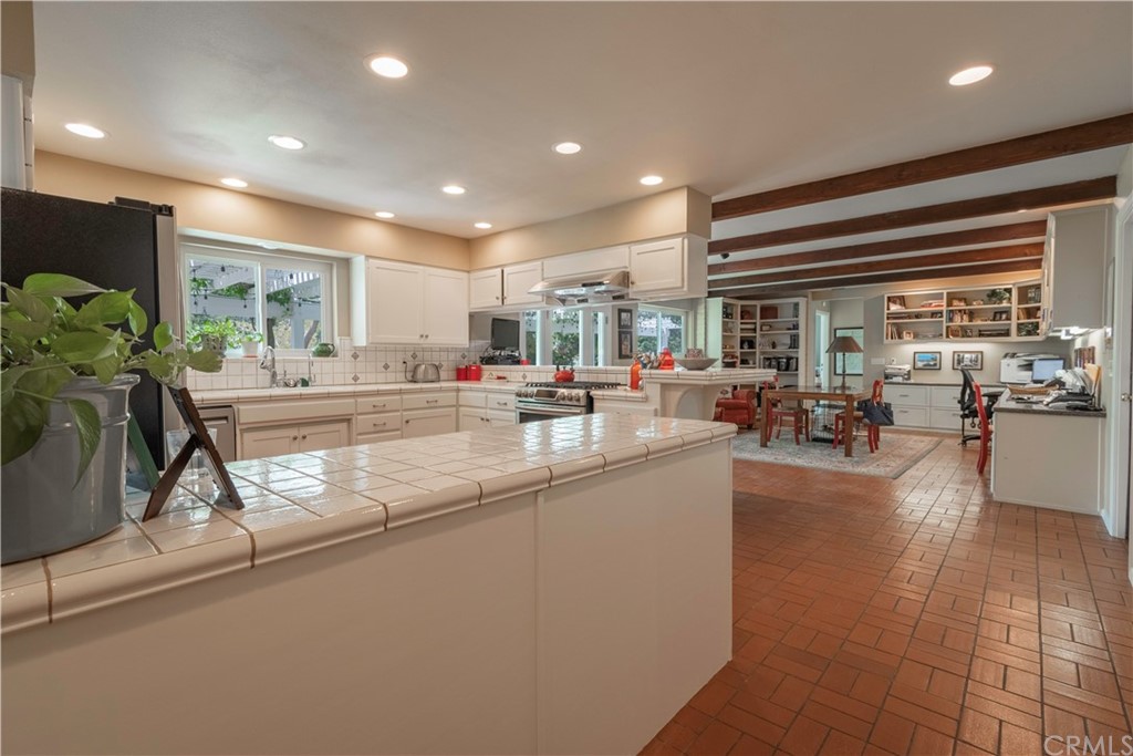 2755 Ardilla Road Atascadero, CA 93422 - Photo 10 of 42 a kitchen with counter top space a sink and cabinets
