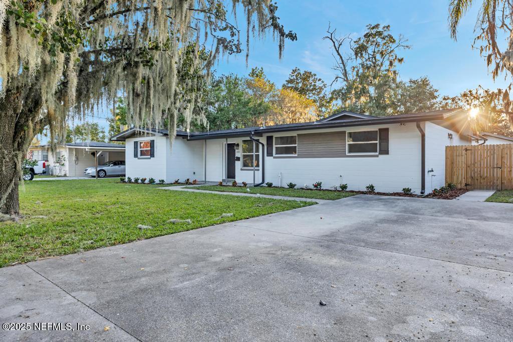 1050 Glynlea Road Jacksonville, FL 32216 - Photo 1 of 38 a view of a house with a yard
