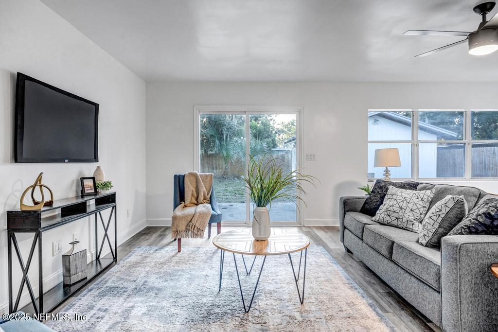 1050 Glynlea Road Jacksonville, FL 32216 - Photo 16 of 38 a living room with furniture and a flat screen tv