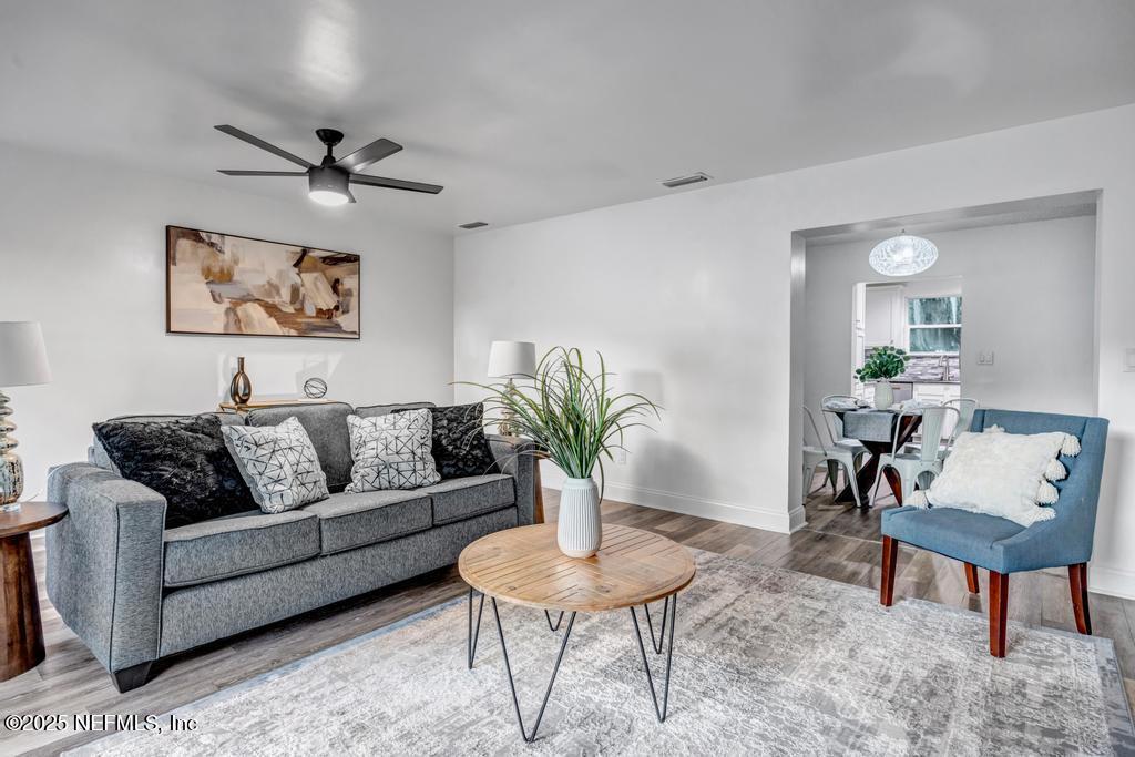 1050 Glynlea Road Jacksonville, FL 32216 - Photo 18 of 38 a living room with furniture and a wooden floor