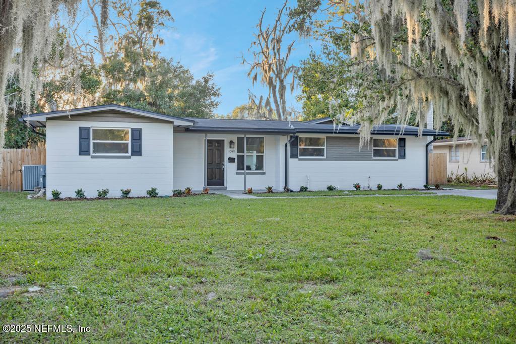 1050 Glynlea Road Jacksonville, FL 32216 - Photo 2 of 38 a view of a house with yard and tree s
