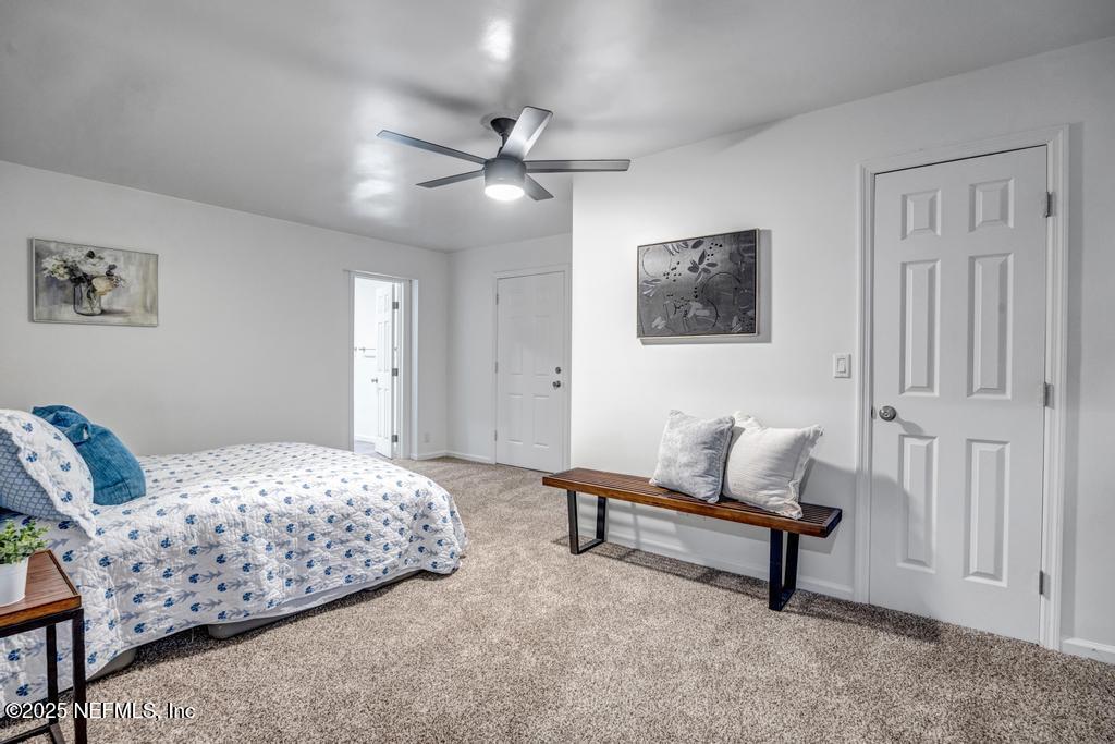 1050 Glynlea Road Jacksonville, FL 32216 - Photo 34 of 38 a bedroom with a bed and furniture