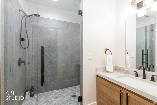 1188 South Old Trappers Loop Road Huntsville, UT 84317 - Photo 52 of 92 Contemporary bathroom featuring a spacious glass-enclosed shower with large format wall tiling and hexagonal floor tiling