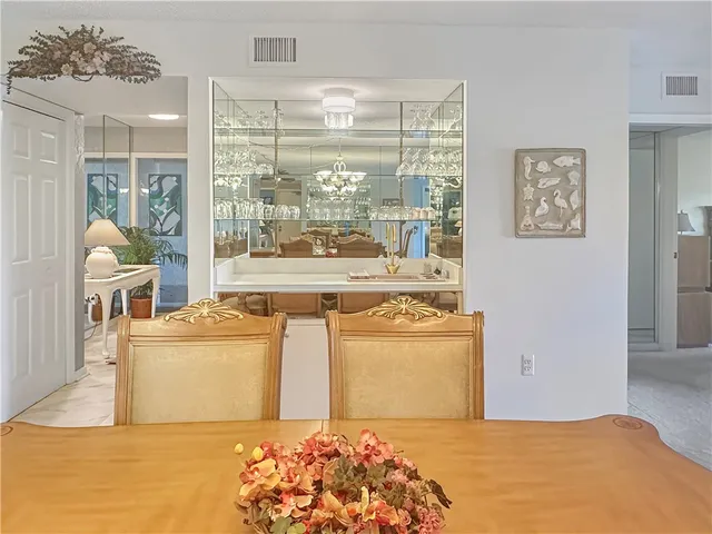 a bedroom with a bed and a stove with wooden floor