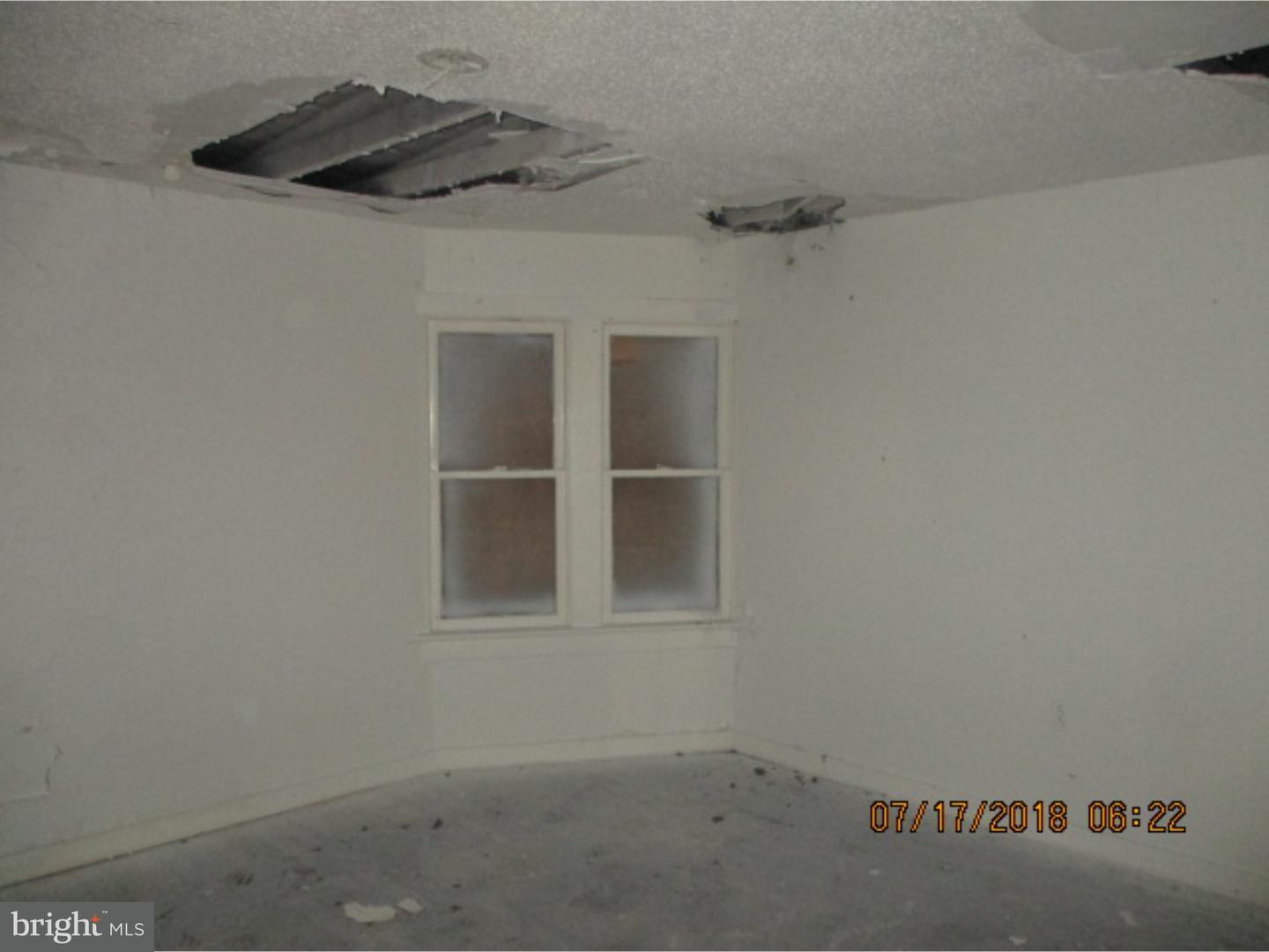 1525 Collings Road Camden, NJ 08104 - Photo 4 of 7 an empty room with a window