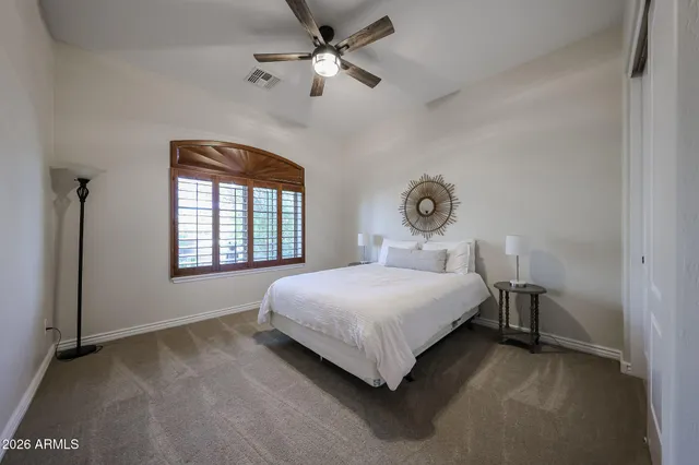 a bathroom with a sink a mirror and a shower