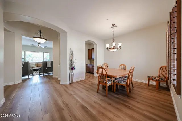 a view of a hallway view with wooden floor and staircase