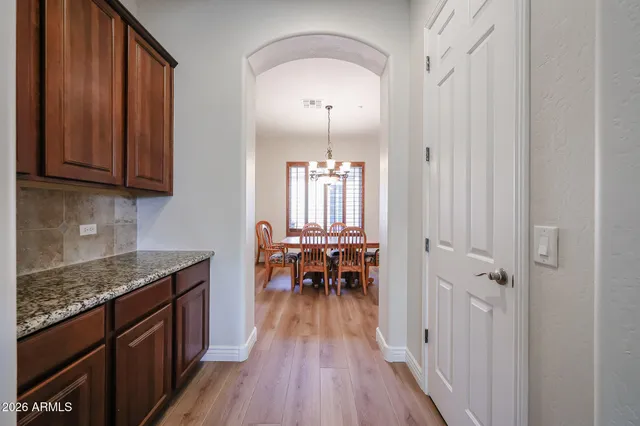 a large kitchen with a table and chairs