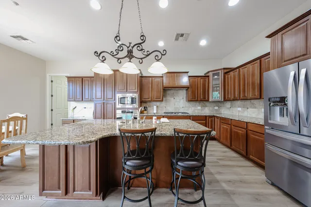a living room with furniture and large windows