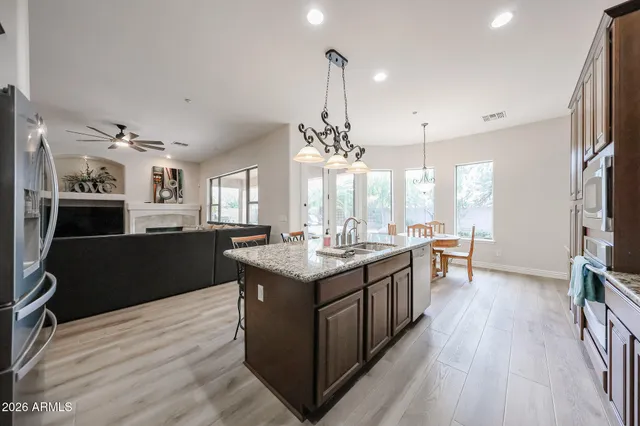 a view of a backyard with sitting area
