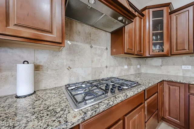 a view of backyard of house with green space