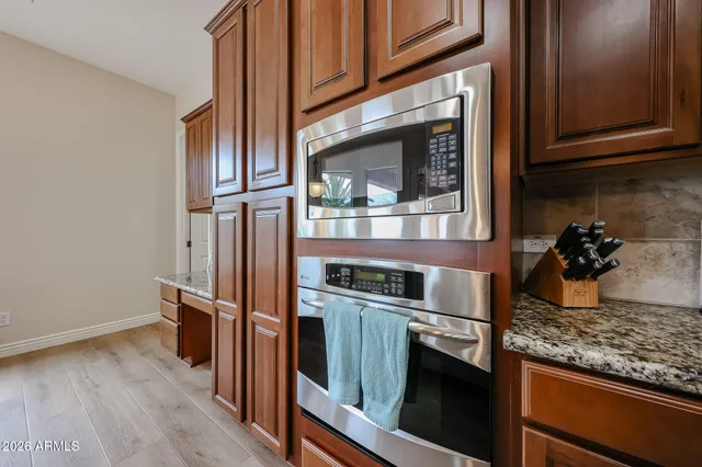 a swimming pool view with a seating space