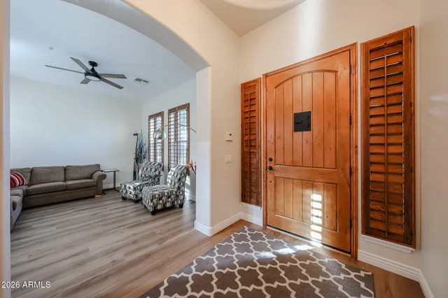 a living room with furniture and a window