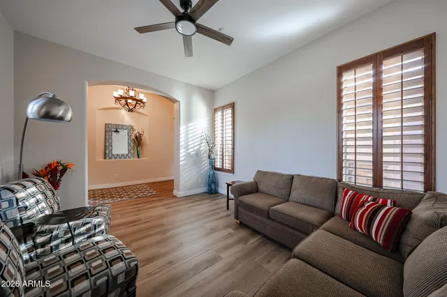 a bedroom with bed and a chandelier