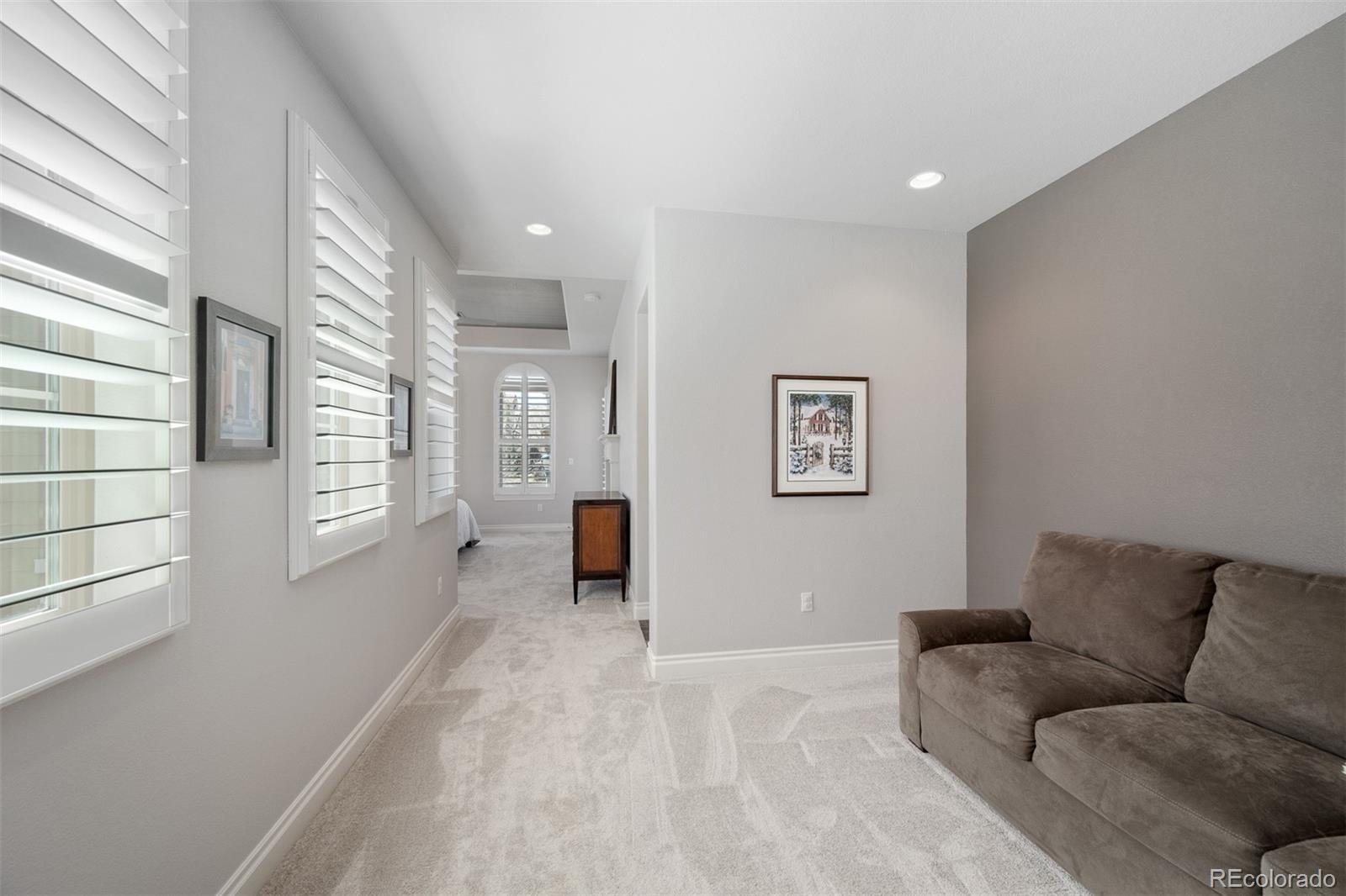 10140 RidgeGate Circle Lone Tree, CO 80124 - Photo 19 of 32 a living room with furniture and a window