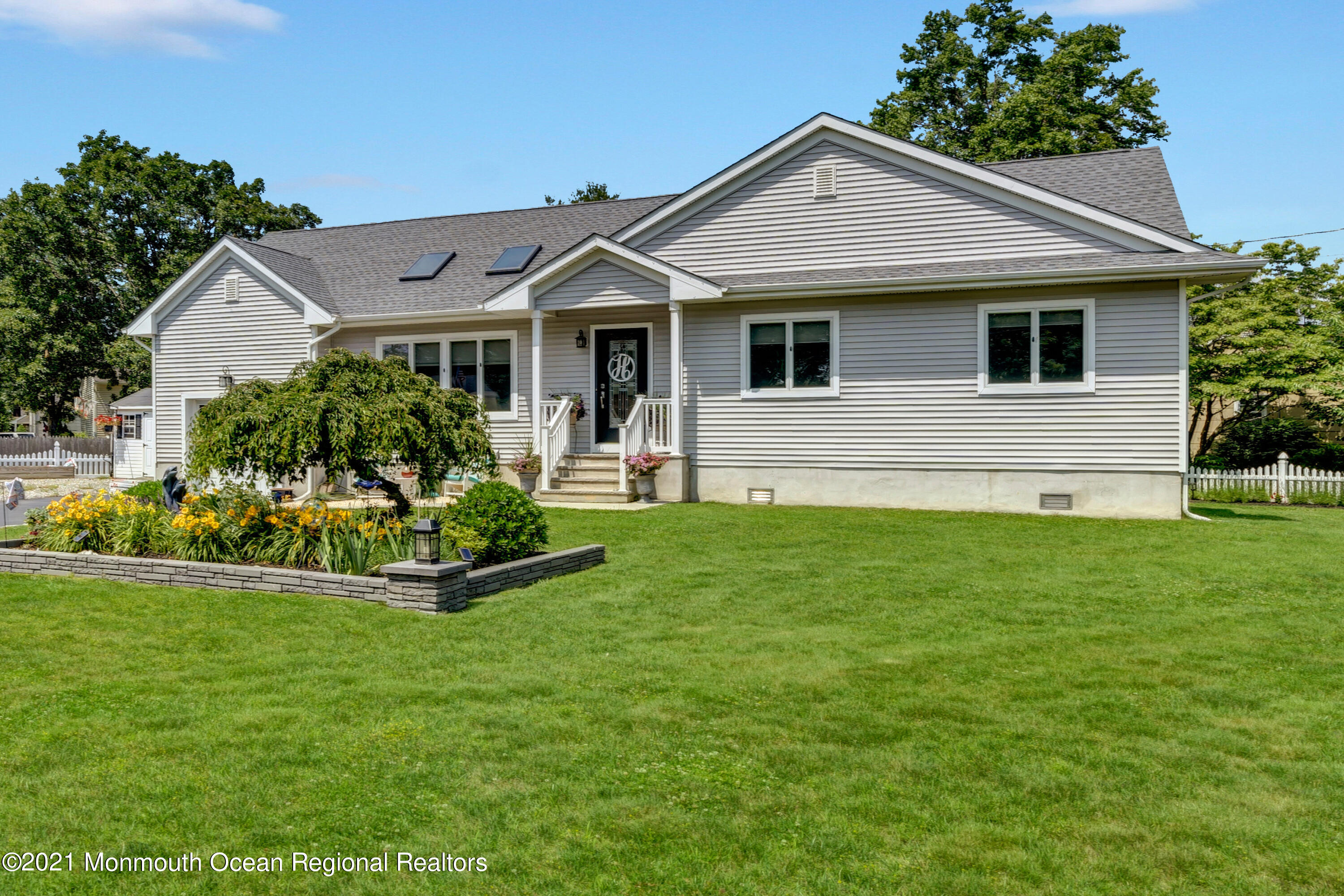 80 Port Road Brick, NJ 08723 - Photo 22 of 29 a front view of a house with a yard and porch