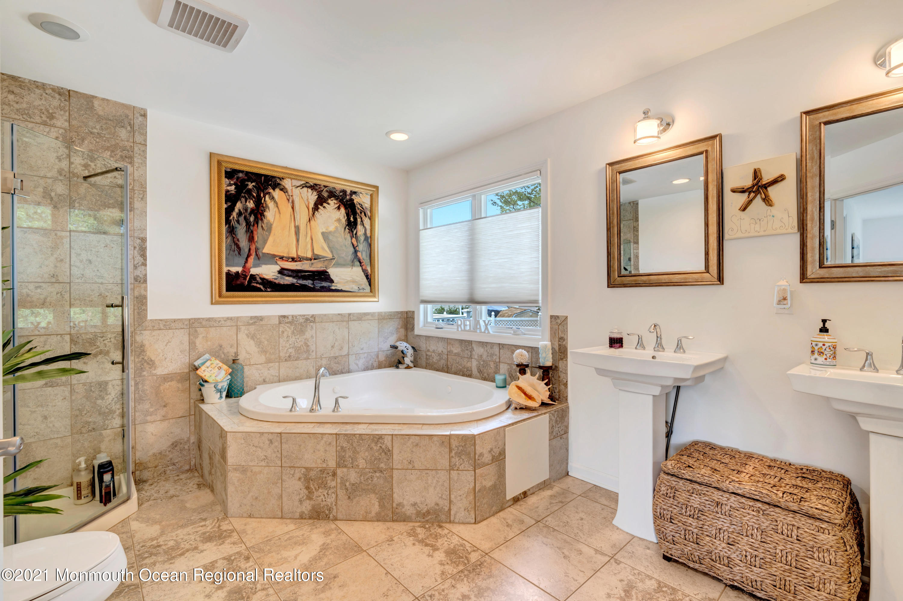 80 Port Road Brick, NJ 08723 - Photo 10 of 29 a bathroom with a tub a sink and mirror