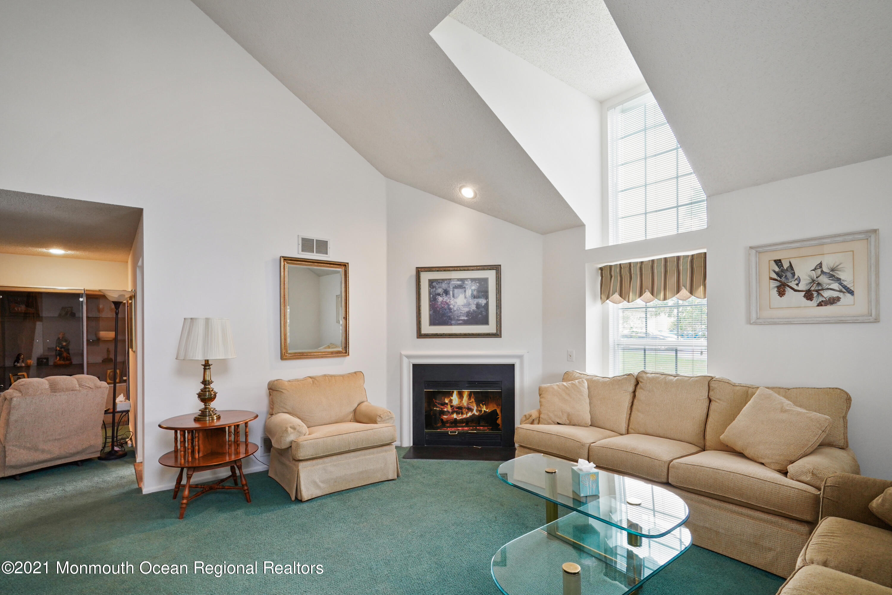 44 Racquet Road Wall, NJ 07719 - Photo 1 of 21 a living room with furniture a fireplace and a large window