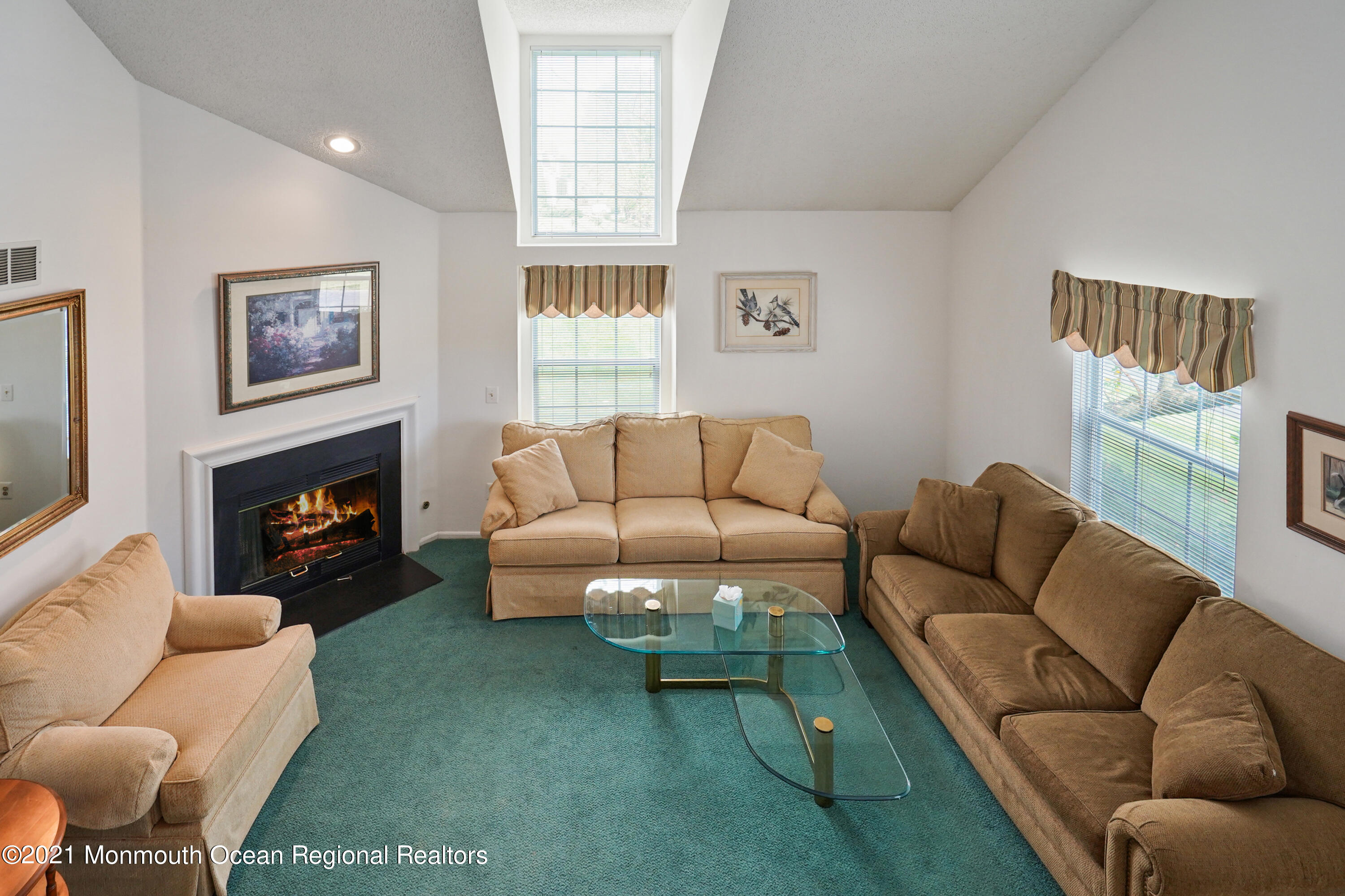 44 Racquet Road Wall, NJ 07719 - Photo 2 of 21 a living room with furniture a large window and a fireplace