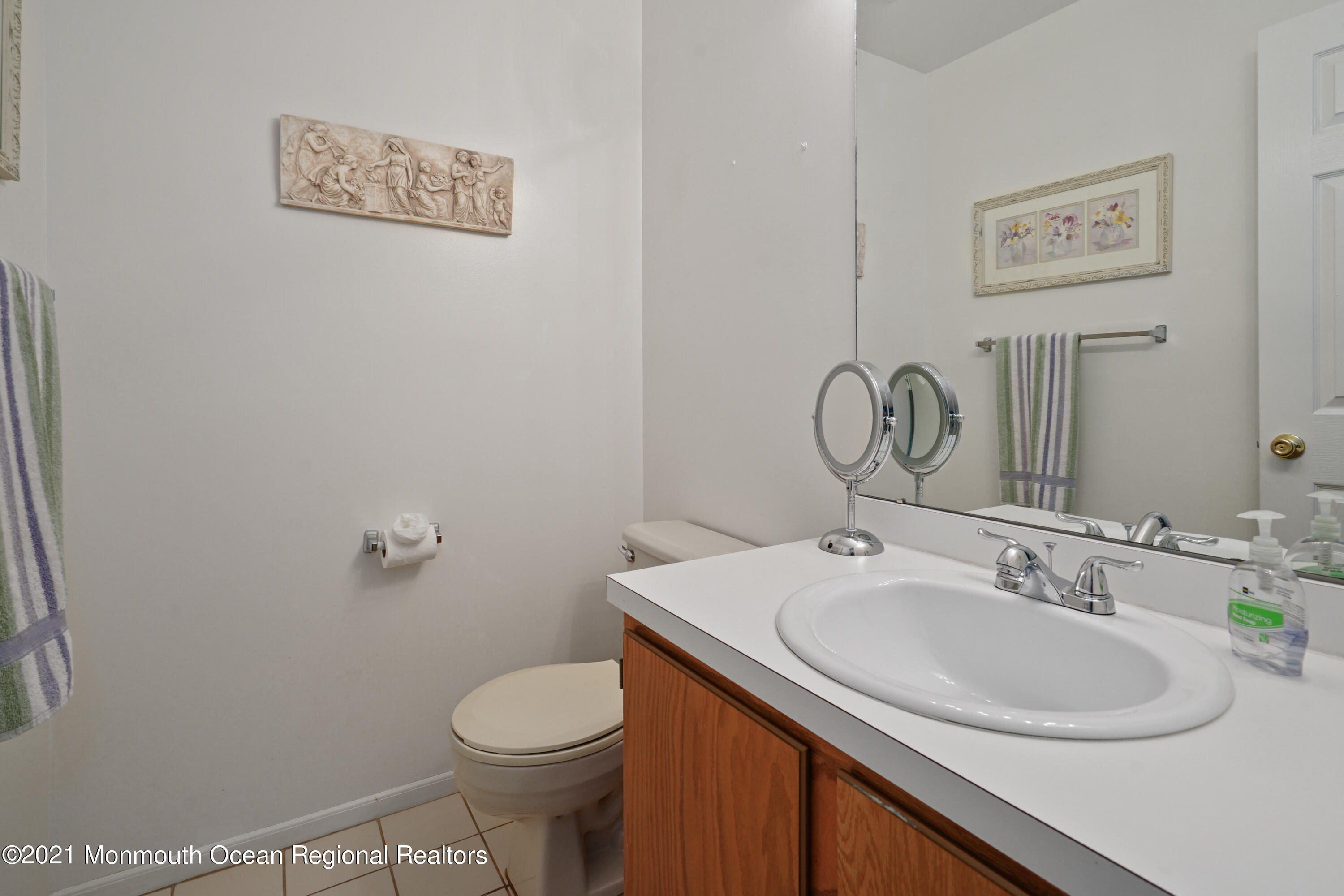 44 Racquet Road Wall, NJ 07719 - Photo 14 of 21 a bathroom with a sink mirror vanity and toilet