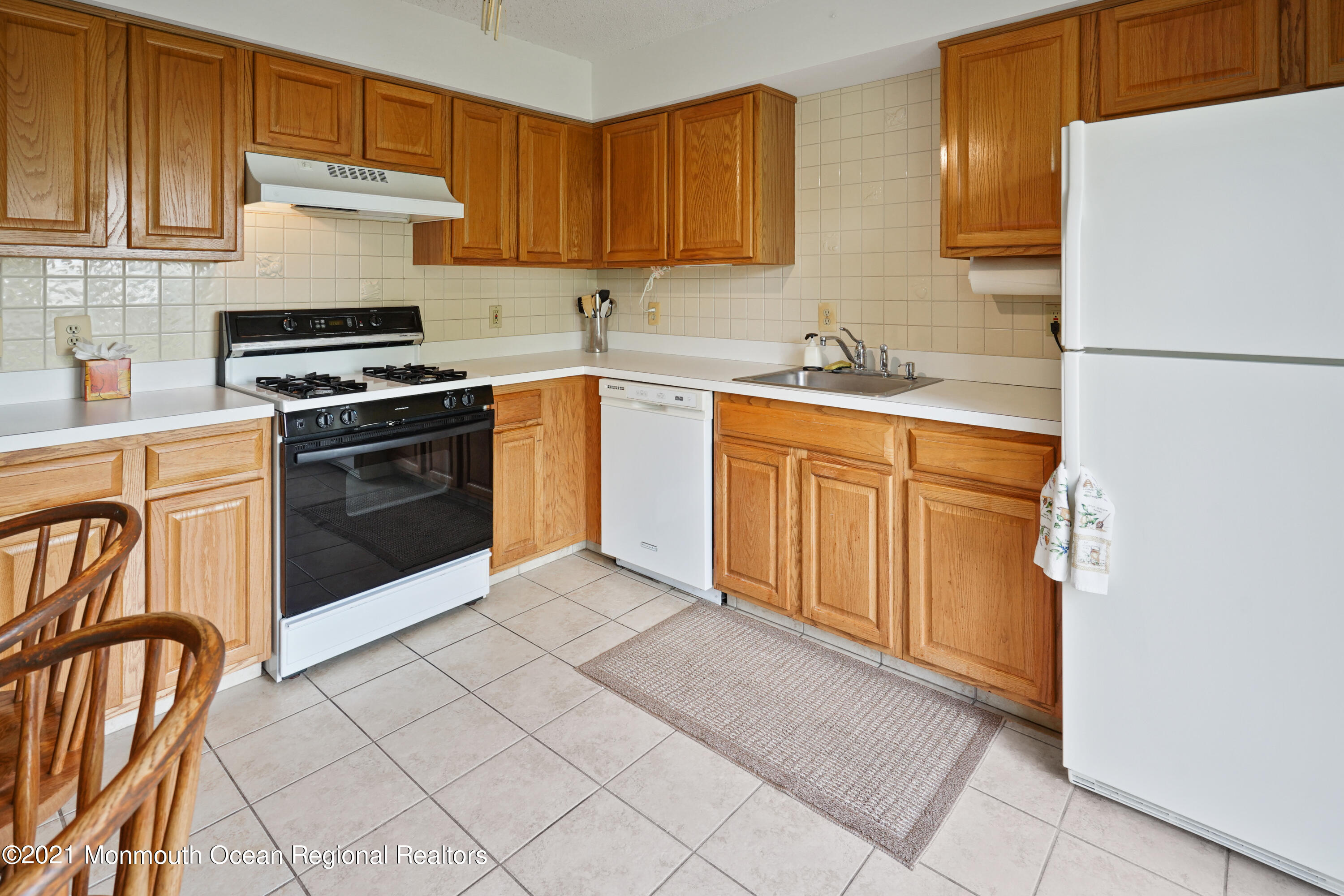 44 Racquet Road Wall, NJ 07719 - Photo 6 of 21 a kitchen with stainless steel appliances granite countertop a refrigerator sink and stove
